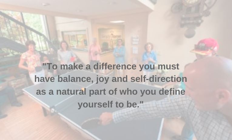 Group ping pong photo with quote